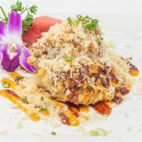 Monkey Brain · Avocado stuffed with spicy tuna lightly tempura fried and topped with blue crab meat, crunch...