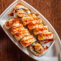 Bear Lover Roll · Shrimp tempura with fresh tuna topped with spicy crab meat, drizzled with eel sauce and spic...