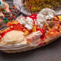 Banana Split · 3 SCOOPS OF ICEREAM ,YOUR CHOICE TOPPED WITH STRAWBERRIES, PINEAPPLES, AND SAUCE OF YOUR CHO...