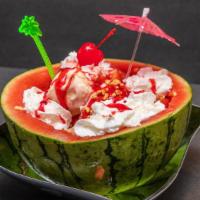 Watermelon Split · HALF WATERMELON SPLIT WITH 5 SCOOPS OF ICECREAM (YOUR CHOICE). TOPPED WITH STRAWBERRIES, PIN...