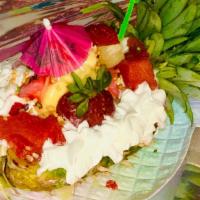 Pineapple Split · HALF PINEAPPLE SPLIT  WITH 5 SCOOPS OF ICECREAM , ( YOUR CHOICE). TOPPED WITH STRAWBERRIES, ...