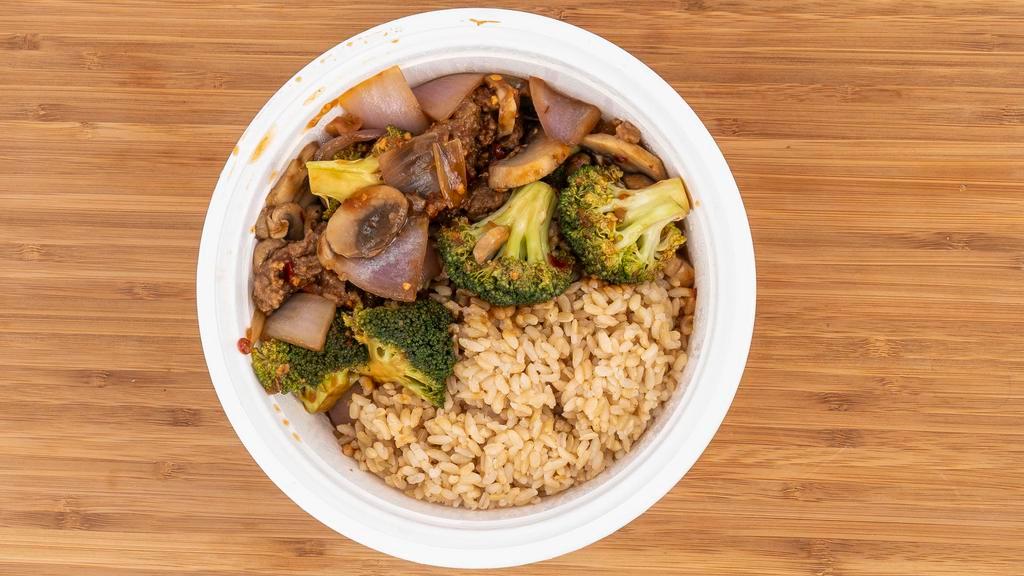 Mongolian Beef · Stir fried flank steak with broccoli, onion, and mushrooms in a spicy, sweet ginger sauce.