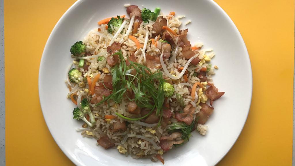 Bacon & Egg Fried Rice · Wok seared bacon with broccoli, carrots, bean sprouts and crumbled egg with ginger sauce on the side.