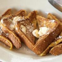 French Toast  · Three slick slices of bread, hand-dipped in our special batter, sprinkled with powdered sugar.