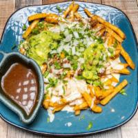 Birria Fries · Large order of fries covered with birria meat, cheese, cilantro, onions, guacamole, and sour...