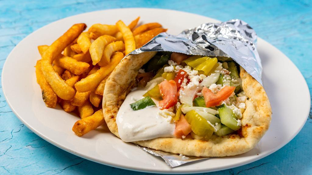 Veggie Sandwich · Fresh tomatoes, cucumbers, peppers, onions, pepperoncini and olives on pita bread topped off with tzatziki sauce and feta cheese.