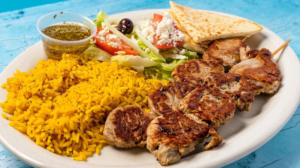 Tenderloin Platter · Two tenderloin shishkabob,Greek rice salad and pita bread.