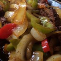 Zapatas Fajitas · Steak or chicken with sauteed peppers and onions. Served with rice, beans, guacamole, sour c...