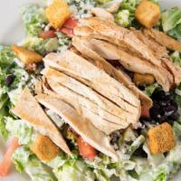 Ranchero Salad · Romaine lettuce tossed with ranch dressing topped with grilled chicken, black beans, roasted...