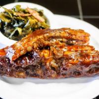 Baby Back Ribs · Baby back ribs marinated and slow cooked in BBQ sauce.