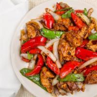 Szechuan Twin Twist · Spicy. Tender sliced chicken and jumbo shrimp sautéed with snow peas, onions, and red bell p...