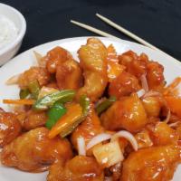 Sweet & Sour Chicken · Breaded white meat chicken sautéed with onions, carrots, green bell peppers, pineapples and ...