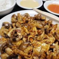 Chicken With Cashew Nuts · Diced chicken sautéed with cashews and mushrooms in the chef's brown sauce.