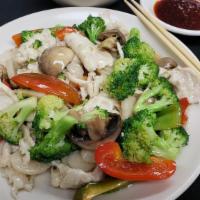 Flower Chicken · Sliced chicken sautéed with water chestnuts, fresh red bell peppers, broccoli and mushrooms ...
