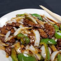 Pepper Steak · Tender beef tossed with green bell peppers and onions in chef's brown sauce.