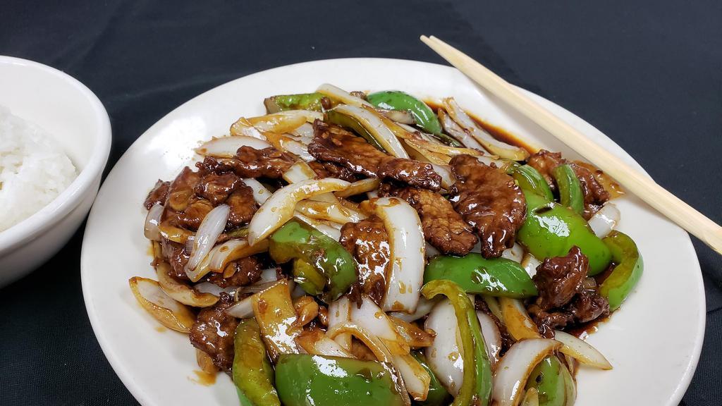 Pepper Steak · Tender beef tossed with green bell peppers and onions in chef's brown sauce.