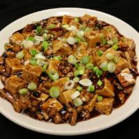 Ma Po Tofu · Spicy. A traditional Chinese dish. Steamed tofu and pork in a spicy black bean sauce, topped...