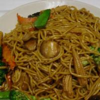 Vegetable Lo Mein · Soft noodles tossed with mixed vegetables in  brown sauce.