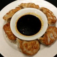 Seafood Dumplings (6) · Pan-fried or steamed. In house made stuffed dumplings with shrimp and seafood. Served with d...