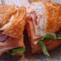 Charleston Smoked Turkey Sandwich · Havarti cheese, bacon, lettuce, tomatoes and roasted red pepper pesto mayonnaise on a sun-dr...