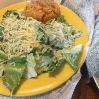 Cafe Caesar Salad · Romaine lettuce tossed with shredded Parmesan cheese and our classic Caesar dressing and top...