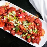 Chilli Chicken · Battered chicken cooked with spices and herbs, tomato, vinegar, soy sauce, and spicy red chi...