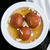 Gulab Jamun (Three Pieces) · Pastry balls soaked in cardamom infused sugar and honey syrup.