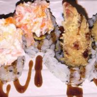 Grizzly Roll · Shrimp tempura, avocado topped with baked crab in cream cheese.