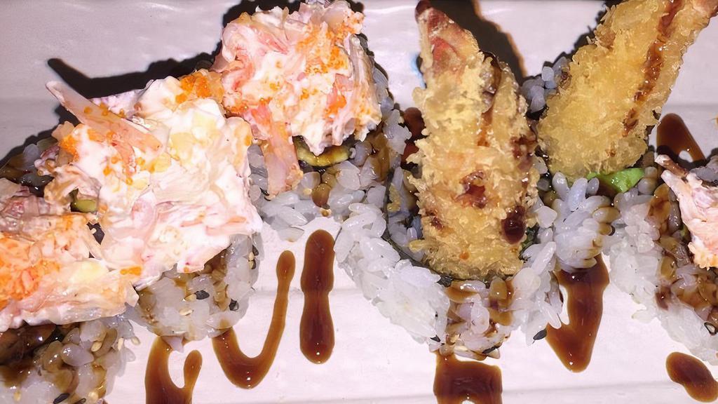 Grizzly Roll · Shrimp tempura, avocado topped with baked crab in cream cheese.