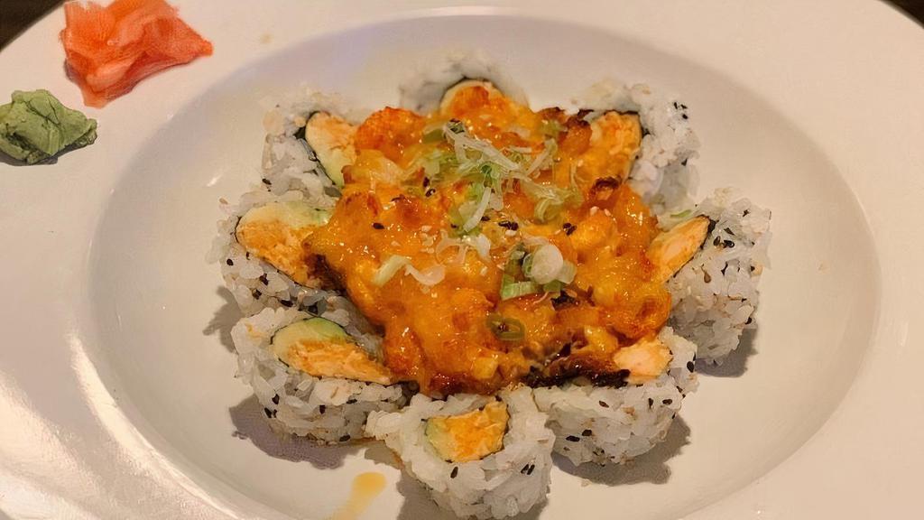 Volcano Roll · Popular, spicy. Spicy crab, avocado topped with baked spicy crawfish and scallion.