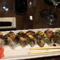 Dragon Roll · Shrimp tempura, cucumber topped with eel and avocado.