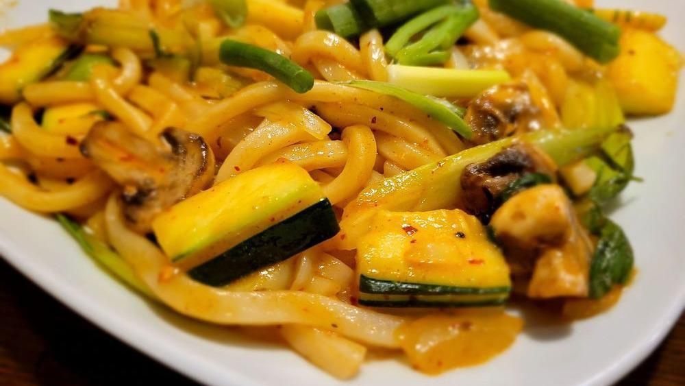 Kimchi Udon · Spicy. Udon noodle stir-fried with zucchini, mushroom, bak choy, onion, with kimchi.