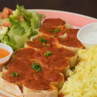 Beyti Sarma Plate · Adana Kebab Wrapped and cut into Pieces topped with tomato Sauce Served with Taziki and Hot ...