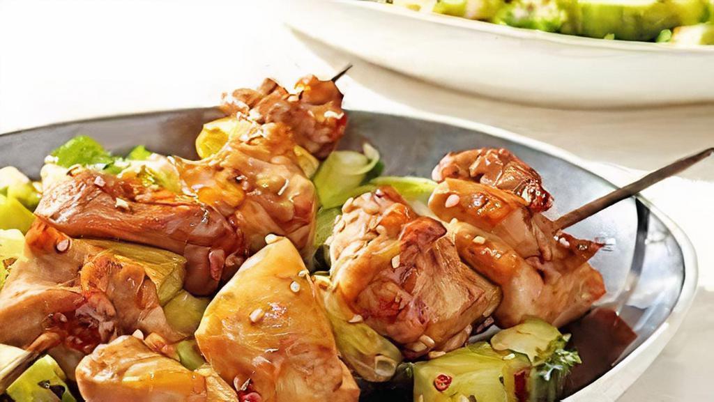 Chicken Teriyaki · 3 pieces of chicken on a stick served with cold cabbage.