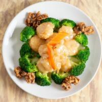 Honey Walnut Prawns · Jumbo shrimp and honey caramelized walnuts, covered in a thick, creamy white sauce. A ring o...
