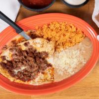 Chori Pollo · Chicken breast covered with chorizo sausage and nacho cheese. Served with rice and beans.