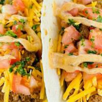Fish Taco · Includes two taco with tomato cheese cilantro and cajun tarter sauce