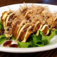 Takoyaki  · Made of a wheat flour based batter and is filled with diced octopus.
