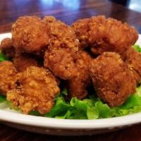 Karaage Fried Chicken · With tender  and juicy marinated  chicken coated in a crispy shell.