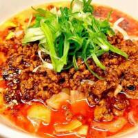Spicy Tan Tan Paitan · Spicy ground  pork and fried  tofu in our creamy chicken broth, topped with spicy garlic sau...