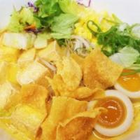 Tofu Yellow Curry Ramen · Fried Tofu in our creamy yellow curry broth, topped with bean sprouts, corn, fried garlic, l...