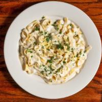 Fettuccine Alfredo · Served with our homemade alfredo sauce.