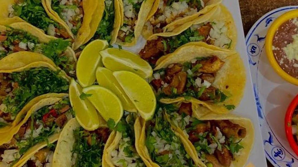 Tacos De Fish · Three flour tortillas taco with fried fish, rice and salad.