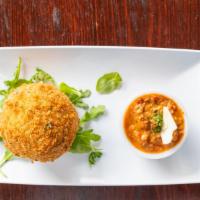 Arancini Riceballs · Served with our bolognese sauce.