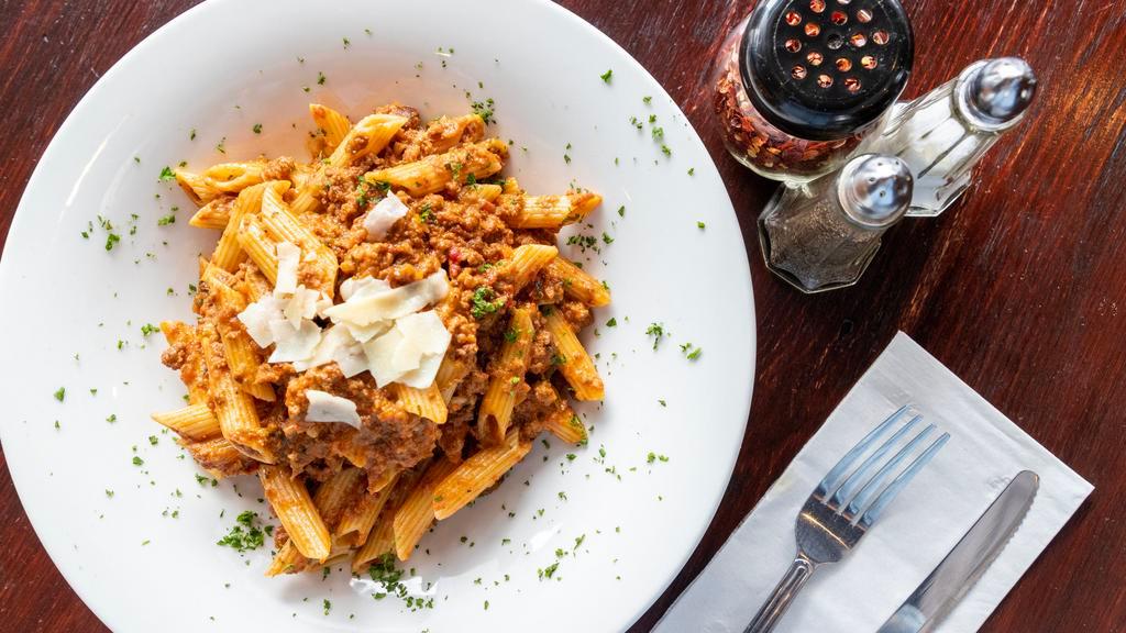 Penne Bolognese · Meat sauce.