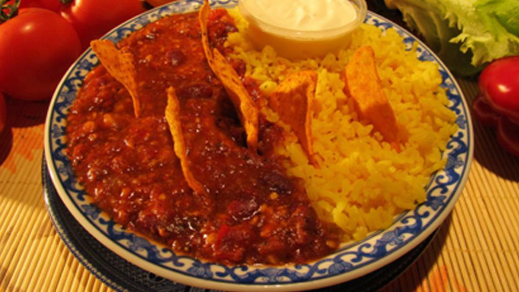 Chili Con Carne · Ground beef, beans, onions. Served with rice, sour cream and nacho chips.
