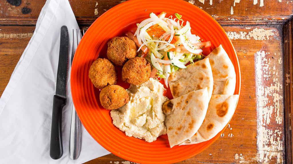 Homemade Falafel Plate · Falafel, Green Salad, Hummus made in-house, Olive Oil, with Toasted Tortilla and Chili Sauce on the side.