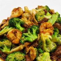 Triple Delight · Jumbo shrimp, beef, chicken with snow peas, broccoli, baby corn, and mushrooms.
