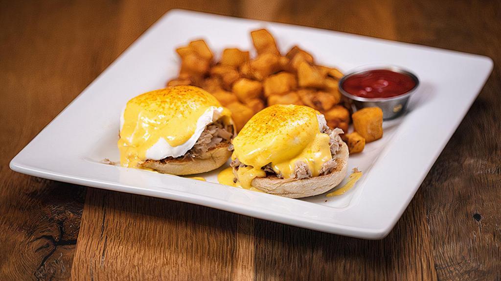 Baltimore Benedict · Lump crab meat, poached eggs and hollandaise on an English muffin, dusted with old bay seasoning, served with hashbrowns.