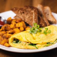 Mediterranean Omelette · Omelette with goat cheese, oven roasted tomatoes, fresh spinach and basil, served with toast...